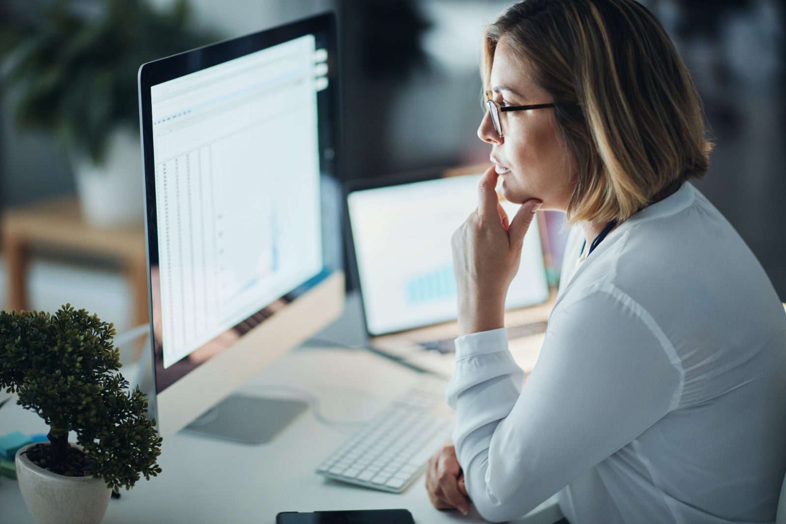 Analyst reviewing data on a computer monitor