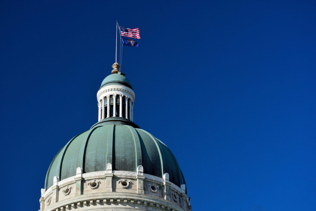 State capitol dome against a clear blue sky